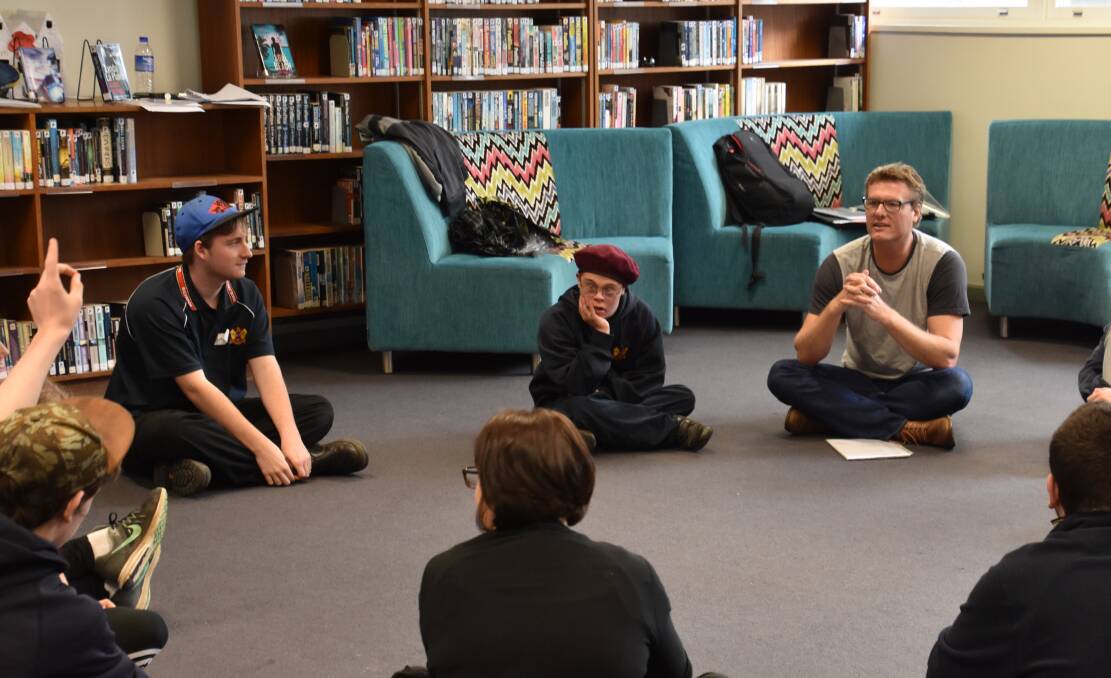 Debrief: Myles Pollard captivates the MESC students as he discusses the Macbeth play and their roles and interactions.