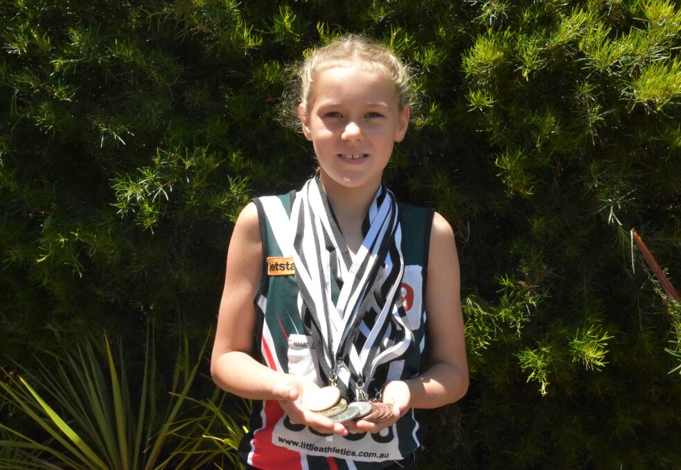 Little champion: Danielle Troode proudly displays the medals she received during the recent Little Athletics Country Championships held in Kalgoorlie. Photo: Lee Steinbacher