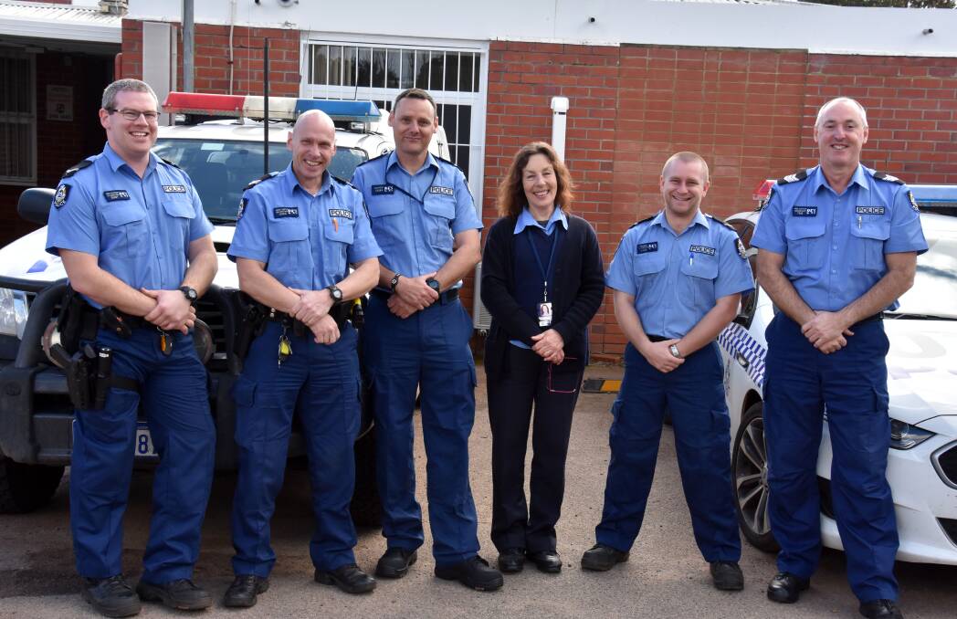 Cops aplenty: New police officer Sean Hawkins (third from left) with co-workers Ben Ducker, Mike Smith, Anne Dhu, Jay Pereira and sergeant Phil Nation. Photo: Lee Steinbacher