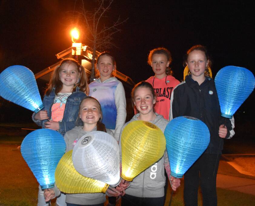 Bright lights: Tess Miller, Chelsea Lukins, Annalise Linnett, Shakira Maxwell, Molly Miller and Abbey Pitts get ready to light up the streets with their colourful lanterns.