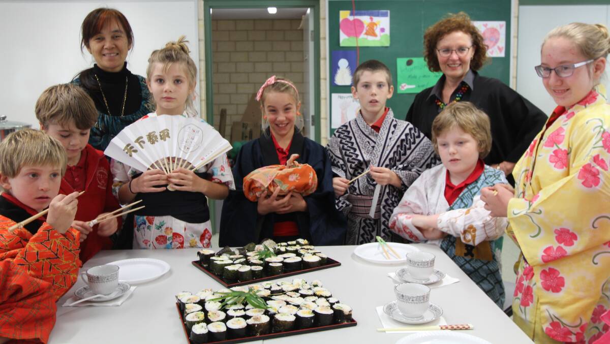 Cultural awareness: Greenbushes Primary School students, Josh Scovell, Christopher Bennett, , Lynsey Boswell, Gypsy Barton, Carl Hahn, Ethan Davies and Brooke Potter  with teacher Yuko Tonai-Moore and Greenbushes CRC Coordinator Angie Cornish at the Japanese cultural activity in May
