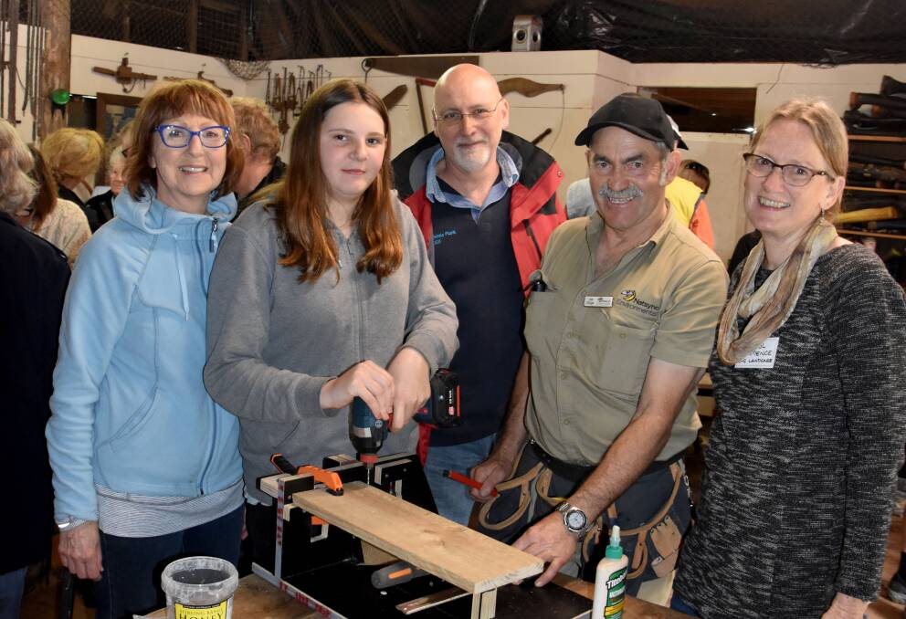 Go Batty: Joe Tonga (second from right) demonstrates how to make a bat box to Nola Stewart, Elise Harrison, Peter Eveson and Cheryl Hamence. Photo: Lee Steinbacher