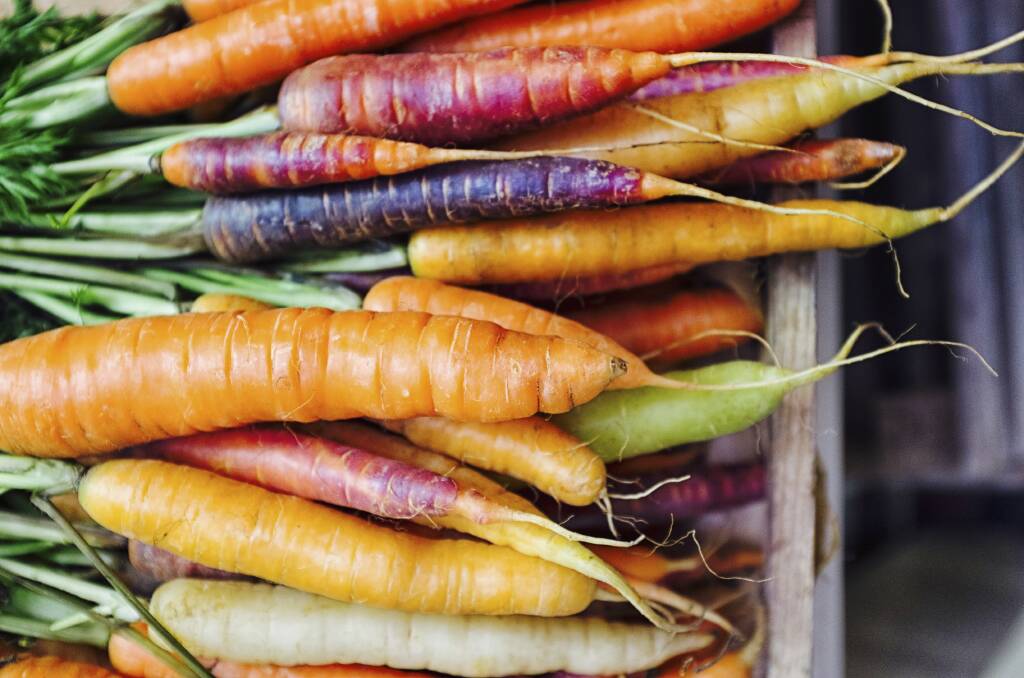 Rainbow carrots bring a splash of colour to the kitchen table. Photo: iStock.