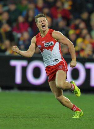 Tom Papley scores a late goal to snatch victory for the Swans at Adelaide Oval on Friday night. Photo: AAP