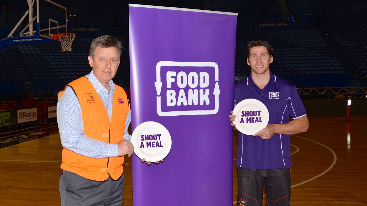 Shout a Meal: Foodbank chief executive Greg Hebble with Foodbank ambassador and Wildcats captain Boomer Damian Martin. Photo: Supplied