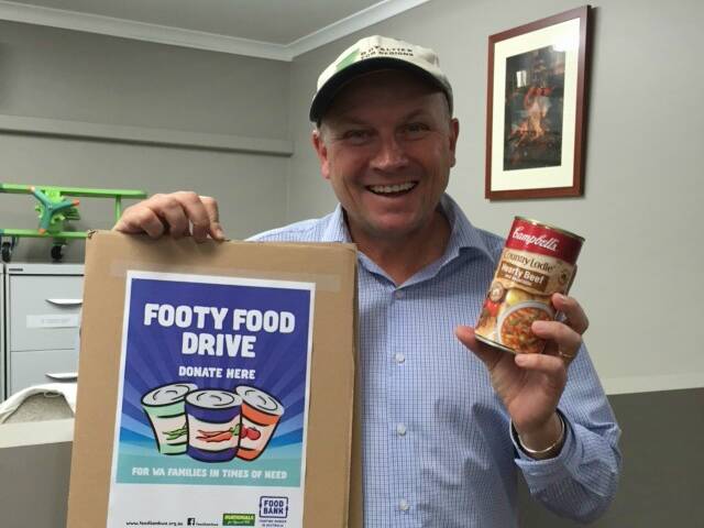 Campaigner: Colin Holt is supporting Foodbank WA by encouraging Donnybrook locals and visitors to donate cans of food towards the cause. Photo: Supplied