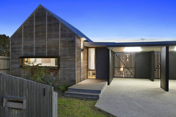 Architect Kim Irons used the old boat shed idiom to shape up this new Barwon Heads home that fits into the town??????s old character.