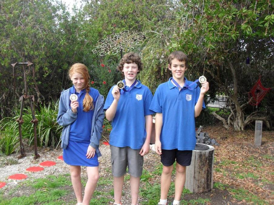 First place: Kirup Primary School students Taylah Oliver, Noah Staines and Zac Peachey show off them medals for being top spellers.