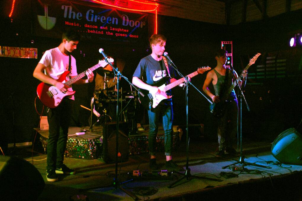 Rockin : Something's Burning, featuring guitarist Ty Mosconi, lead singer Sam Shepherd, bass guitarist Luke Brodie and drummer Jacob Kestel set the beat for the Youth Week party at the Green Door.