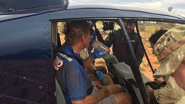 Mr Foggerdy shortly after being found by TRG trackers in the WA outback. Photo: WA Police 