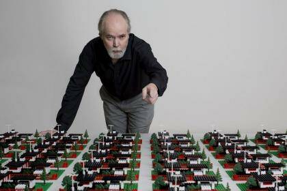 Douglas Coupland with a work from his survey art exhibition in Vancouver, "Everywhere is Anywhere is Anything is Everything". 
 Photo: Brian Howell
