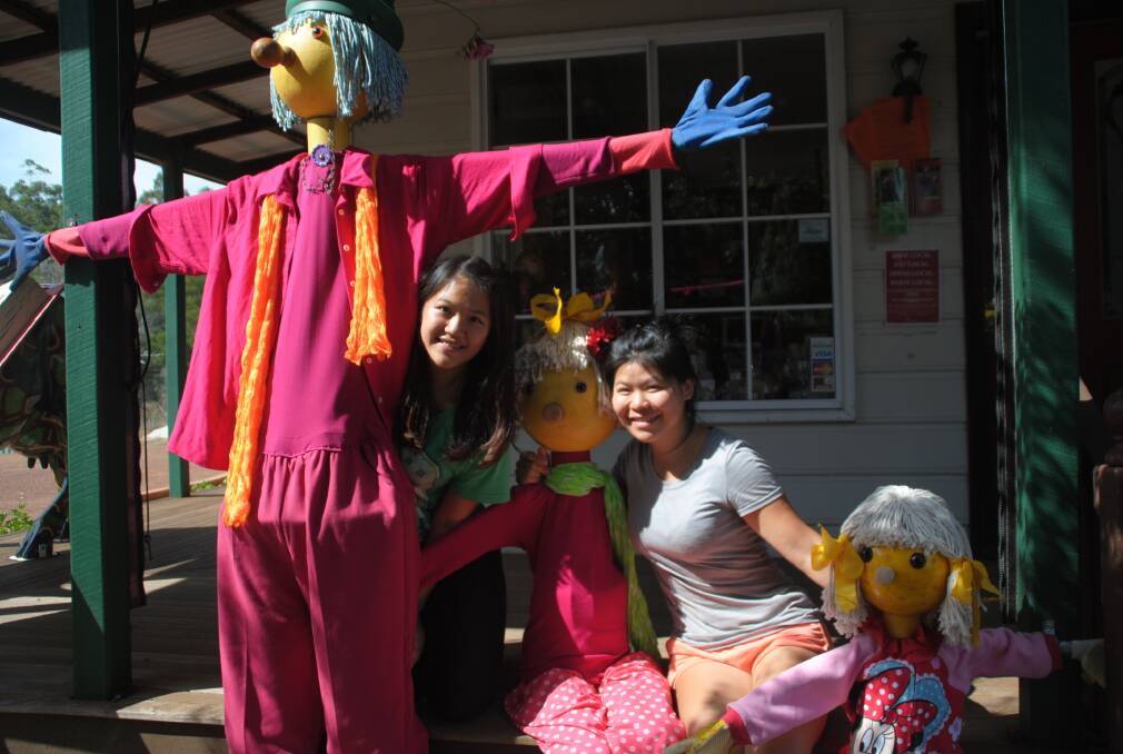 Well met: Backpackers Maggie Lin and Tatiana Weng meet some of the Balingup scarecrows.