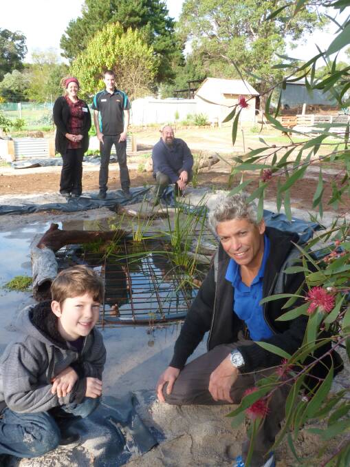 Leaps and bounds: Frog Doctor Johnny Prefumo with Maddox Lansdell , Tracy Lansdell, Blackwood Basin Group Priority Bittern and Waterbird Biodiversity project officer Joby Rand and Mark Lansdell view the progress made at the Greenbushes Community Garden during the Frog Workshop on Saturday June 14.