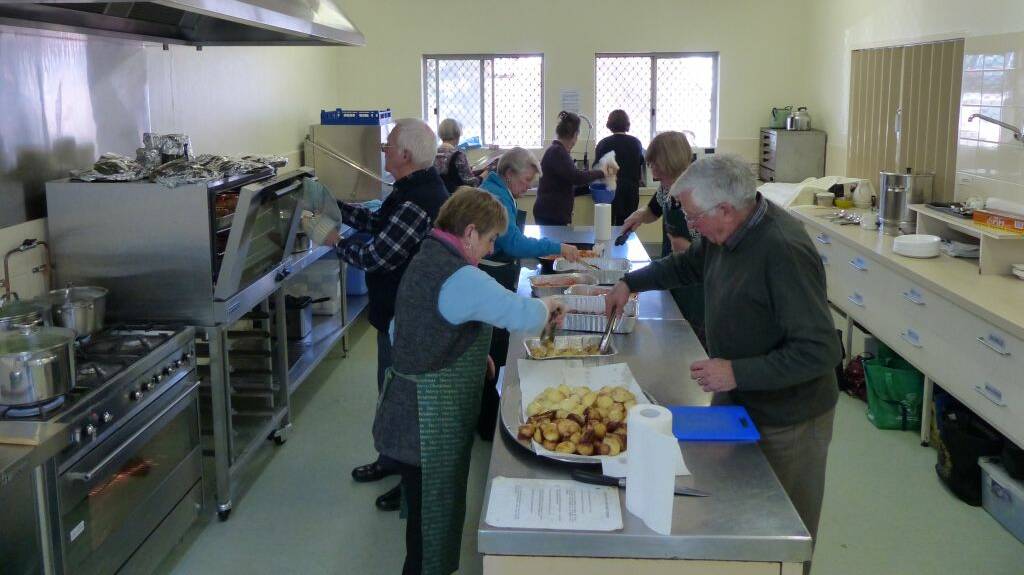 Cooking up a storm: the committee and friends prove they can cook as well as grow great food. Photo: Brian Moore.