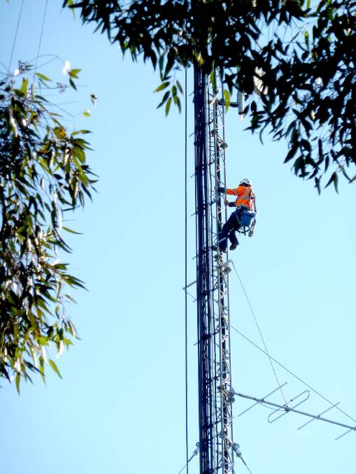 Another day on the job: A workman climbs the tower. Photo: Terry Linz,