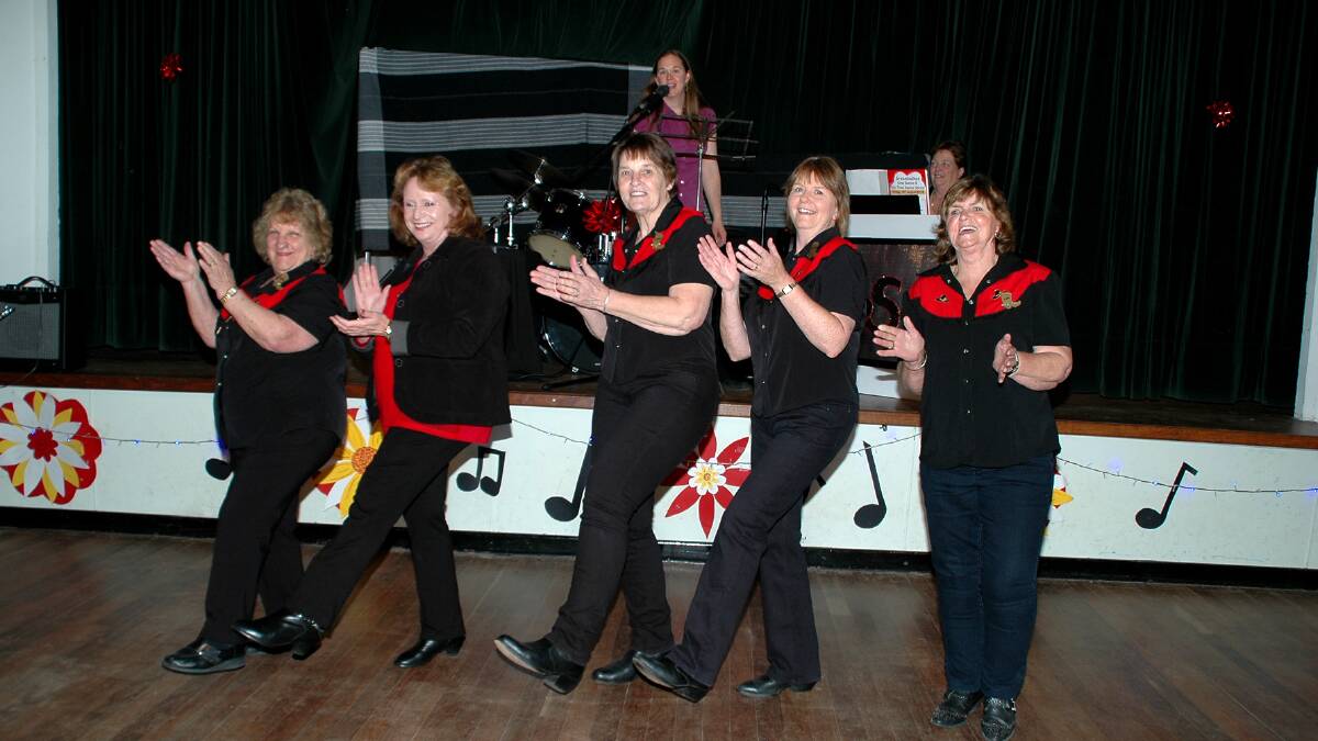 Demonstrating some simple line dancing steps are Vienna Radovic, Lyn Gardiner, Instructor Audrey Brown, Leonie Eastcott and Shirley Allen.