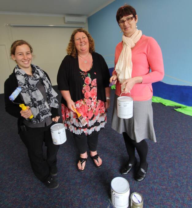 Greenbushes Community Resource Centre Coordinator Fran Bullock (centre) and trainees Darcey Yates and Rachel Pollett paint the interior walls of the new extension in preparation for the official opening on August 22.