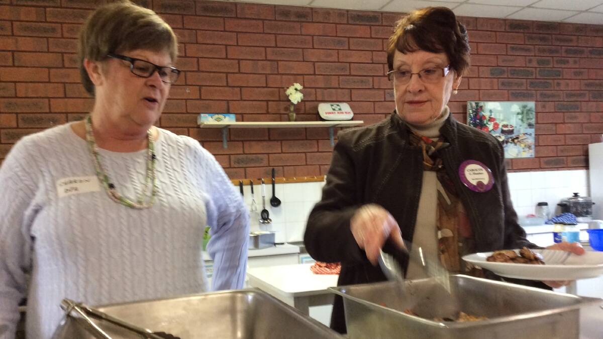 Hard at work: Sharon Smith and Carolyn Hunter keep the kitchen running.