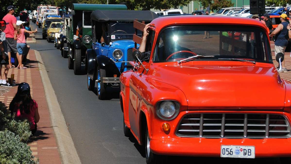 Classic cars take part in the parade at the 2013 Donnybrook Apple Festival.