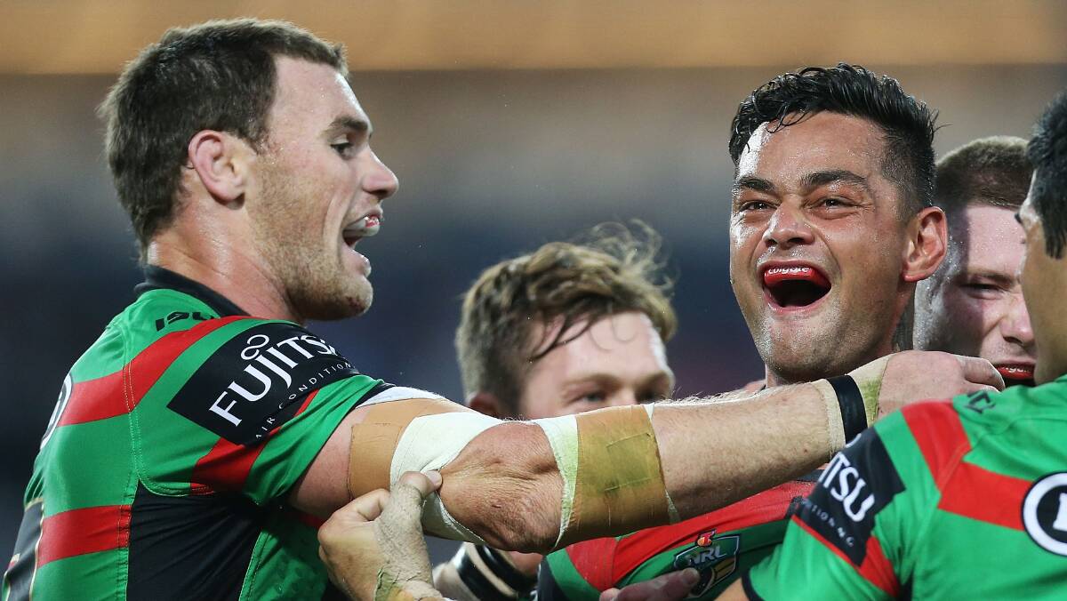 John Sutton of the Rabbitohs celebrates with team mates after scoring a try during the round seven NRL match between the South Sydney Rabbitohs and the Canterbury-Bankstown Bulldogs at ANZ Stadium on April 18, 2014 in Sydney, Australia. Photo: Mark Metcalfe/Getty Images.