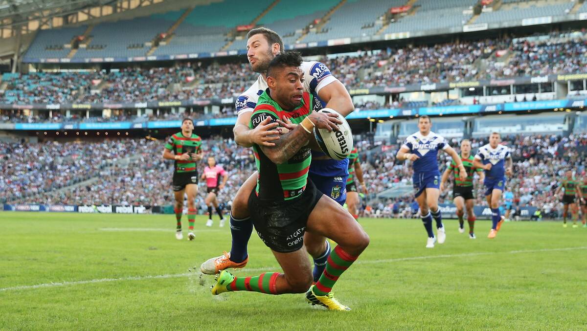 Nathan Merritt of the Rabbitohs fails to gather the ball over the try line as he is tackled by Mitch Brown of the Bulldogs during the round seven NRL match between the South Sydney Rabbitohs and the Canterbury-Bankstown Bulldogs at ANZ Stadium on April 18, 2014 in Sydney, Australia. Photo: Mark Metcalfe/Getty Images.