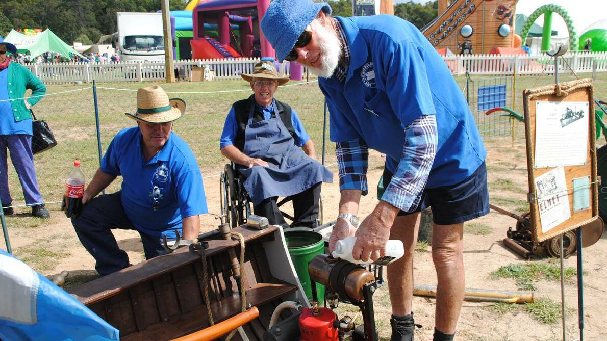 Eric Schulstead, Keith Schulstead and John Cannon demonstrate the workings of old machinery at last year's festival.