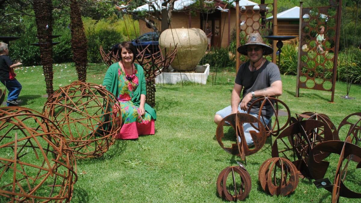 Kerry and Greg Gelmi with their “Gathering Rust” sculptures at last year’s Expo.