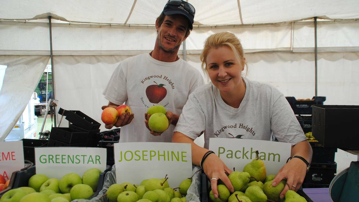Will Keusch and Naomi Tennet at the 2013 festival, showing off their fresh produce in the produce tent.