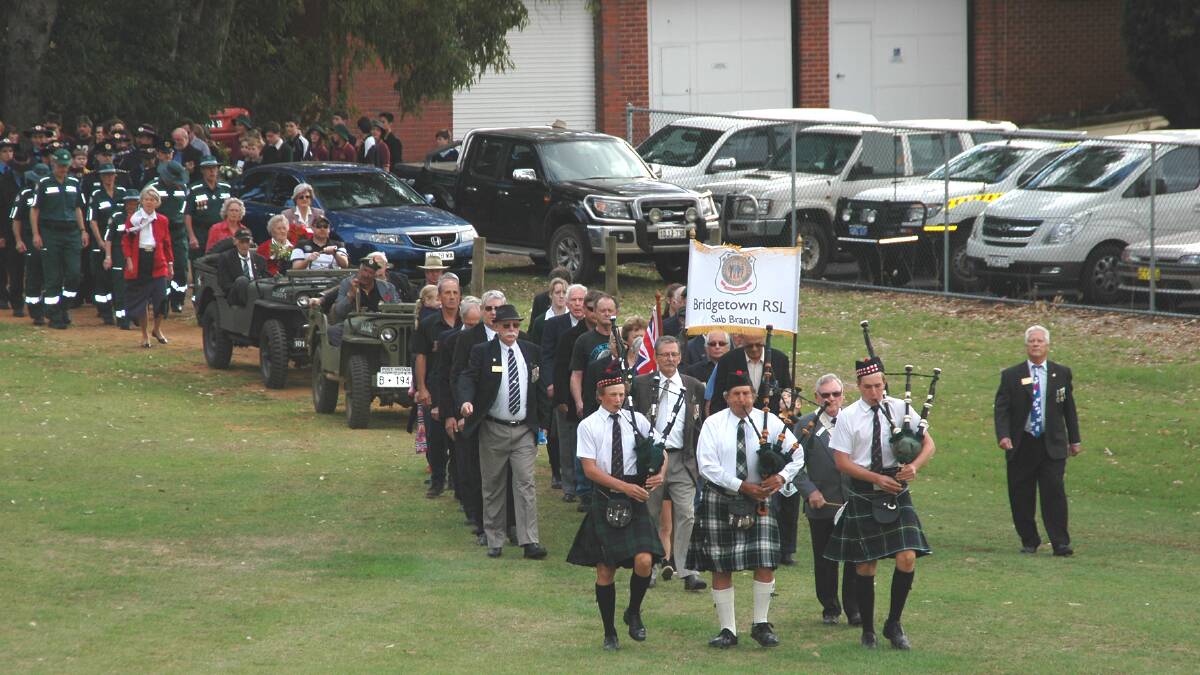 March: Led by the pipes of the Campbell family, the parade marches into memorial Park. Photo: Donnybrook-Bridgetown Mail.