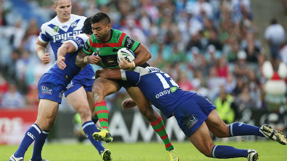 Nathan Merritt of the Rabbitohs is tackled during the round seven NRL match between the South Sydney Rabbitohs and the Canterbury-Bankstown Bulldogs at ANZ Stadium on April 18, 2014 in Sydney, Australia. Photo: Mark Metcalfe/Getty Images.