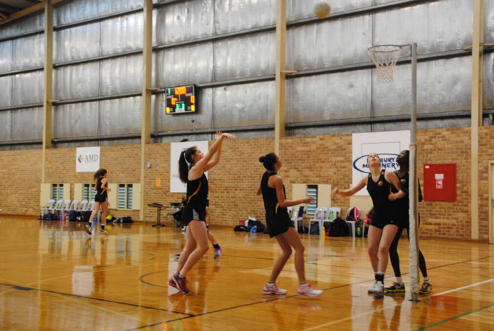 Warm up: Shantelle Tassone and other members of the state schoolgirls 15s get ready for their morning’s match. 