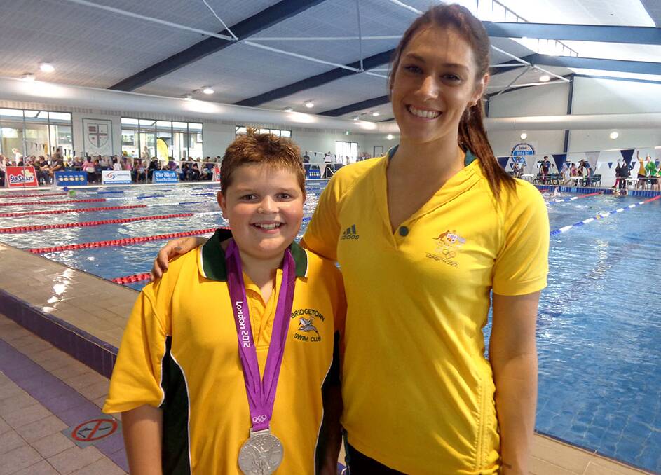 Ben Bullock from Bridgetown wears 2012 Olympian Blair Evan’s silver medal at a recent meet in Perth. 