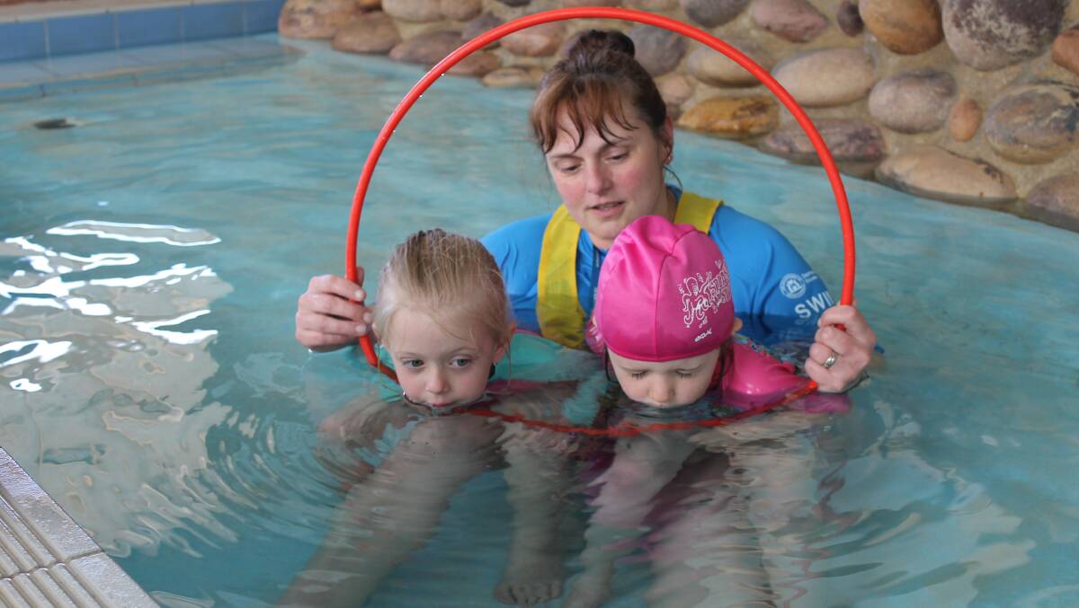 VacSwim: Instructor Sally Baker with participants Nadine Hill and Freya Browning. 