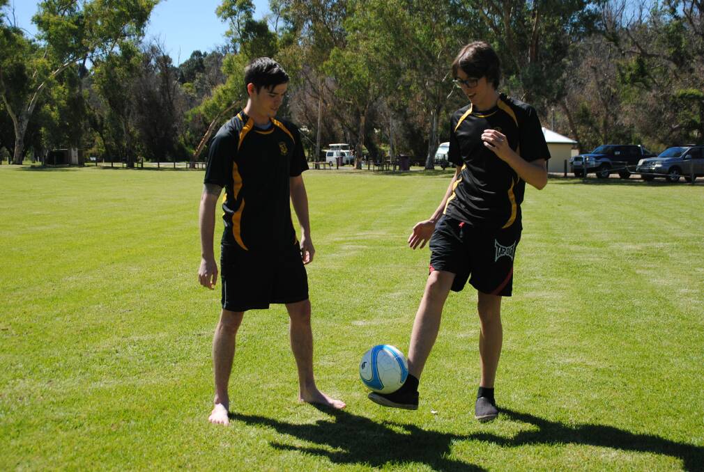 Warming up: Jules and Angus Davey get ready for the upcoming soccer season. 