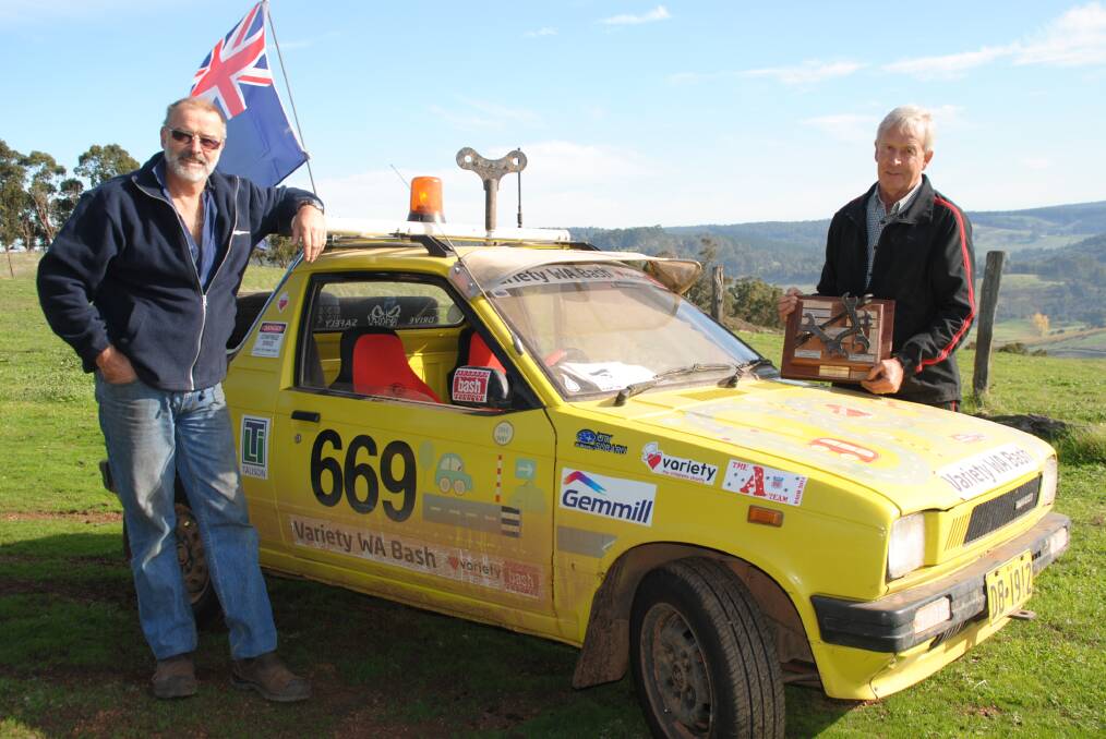 Naughty boys of Balingup: Chris Spence and Edgar Hawter with the car that took them more than 5,000km last year. 