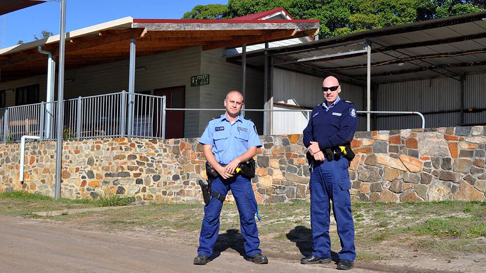 Bridgetown Police 1st Class Constable Jay Pereira and Acting Sergeant Mike Smith outside the venue of the assaults. 