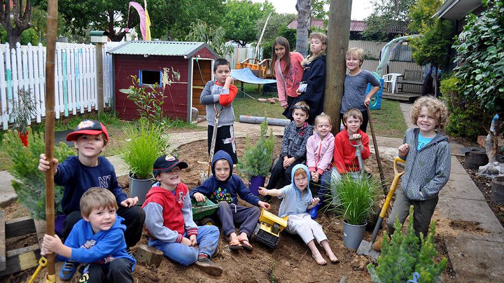 Jacob, Jarvis, Riley, Austin, RJ, Laim, Victoria, Lilian, Clover, Leon, Grae, Rowan and Smith all enjoy making a fun garden area to play in as part of their school holiday program. 