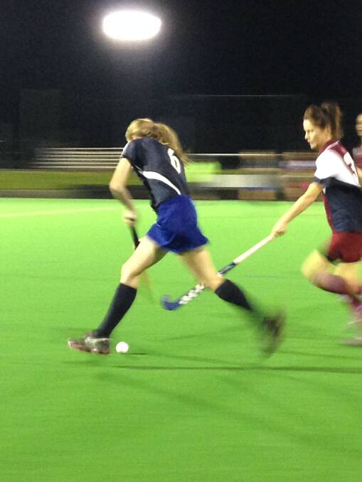 Sharna Denholm carries the ball into attack. 