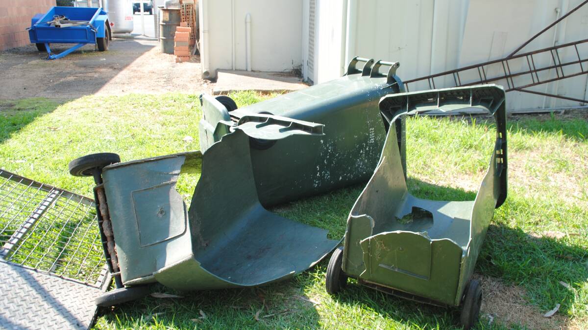 The remains of bins hit by the speeding vehicle. 