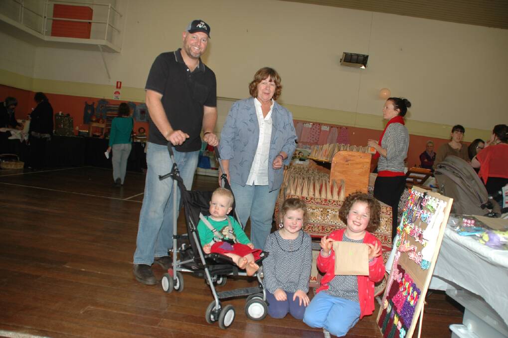 Fun: Andrew Royce with his children Campbell, Maggie and Ella, and stall holder Lyn Livesey.