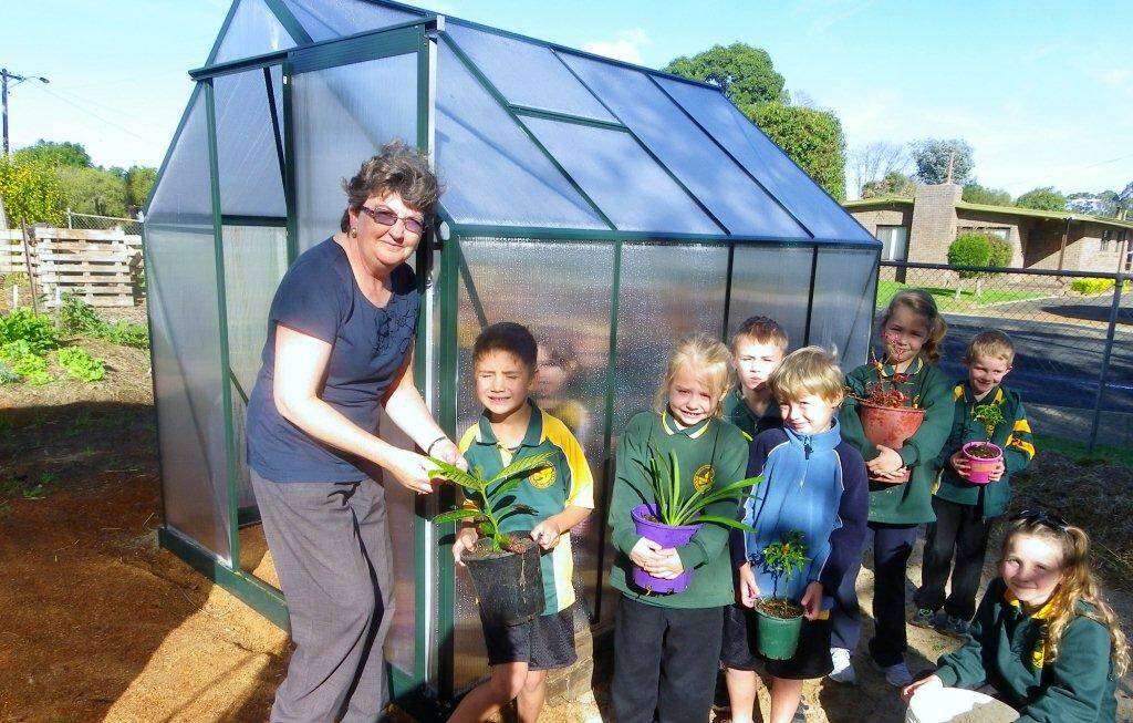 Green thumbs: Teacher Marion Lewis with Noah Irwin, Ava Wright, Ayden Noakes, Lukas Hale, Kasey Wood, Max Morris and Poppy Chance.