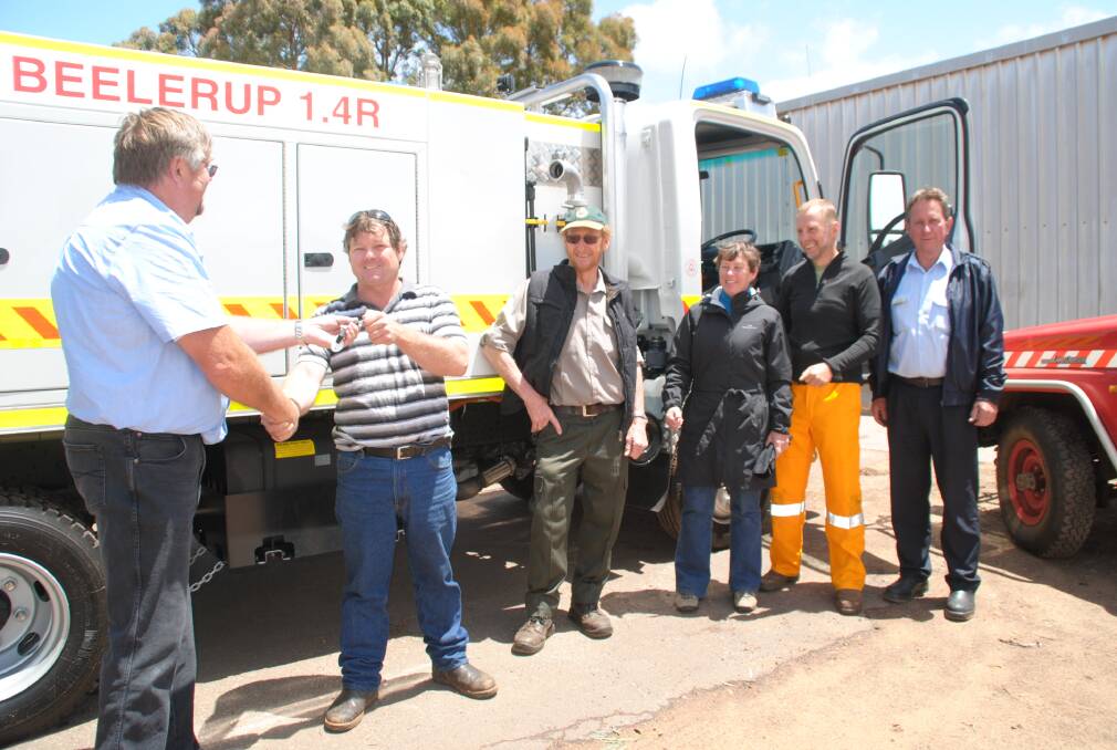 CAP: John Foord hands over the keys to the new appliance to Dave Denholm, watched by Ranger Bob Jeffreys, Lindsey Loweth, Roger Loweth and Ken Butler.