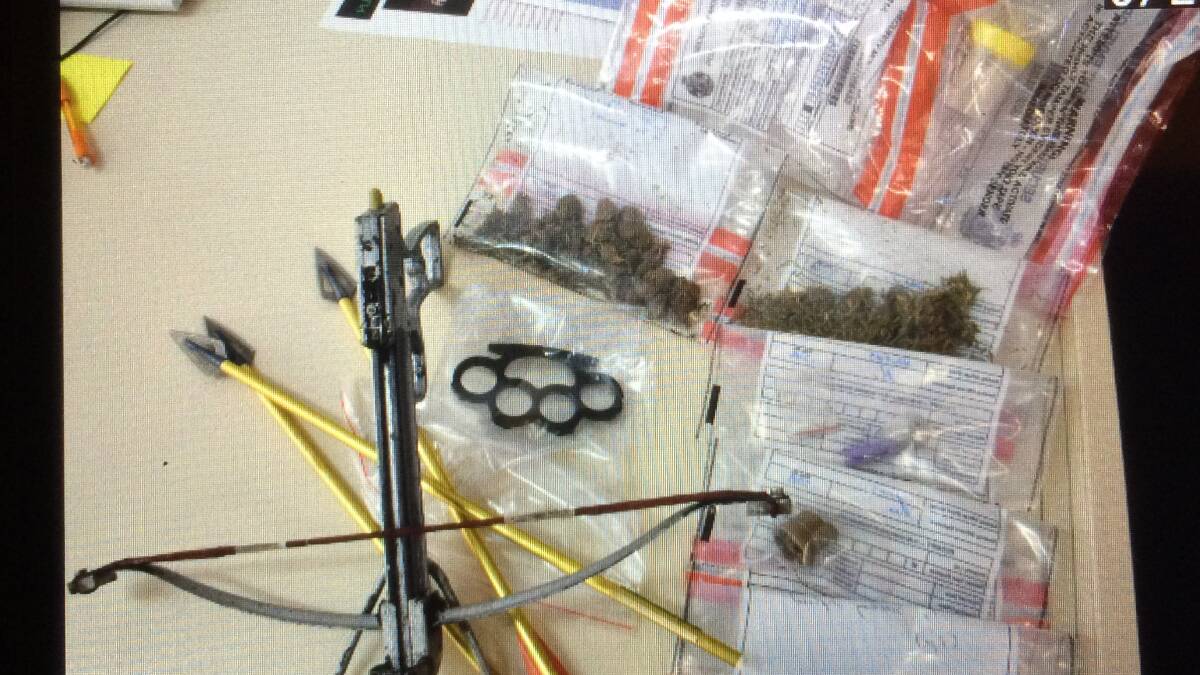 Busted: Drugs and weapons found during a raid in Bridgetown this morning. Photo: Lee Steinbacher
