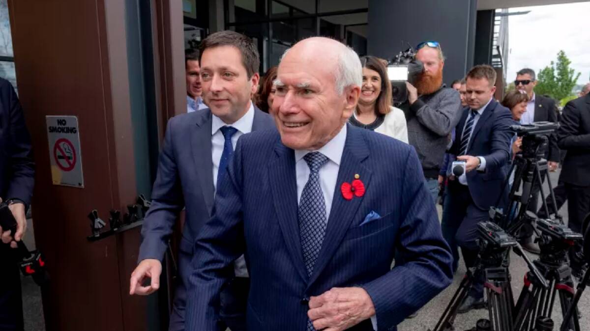 Former prime minister John Howard wows the fans at Fountain Gate. Photo: Luis Enrique Ascui