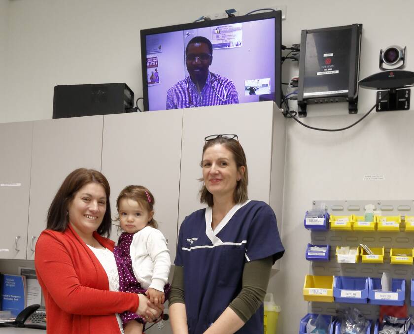 Ava Fuge and mum Marion in Pemberton Health Service’s emergency room with two of the clinicians who helped save her, nurse Jess Byers and Emergency Telehealth Service doctor Mlungisi Mahlangu (on screen). Photo: supplied