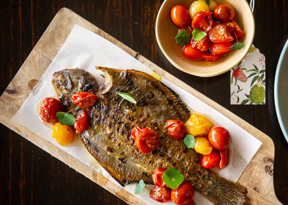 Barbecued flounder with tomato burre blanc and confit cherry tomatoes. Picture: Elesa Kurtz