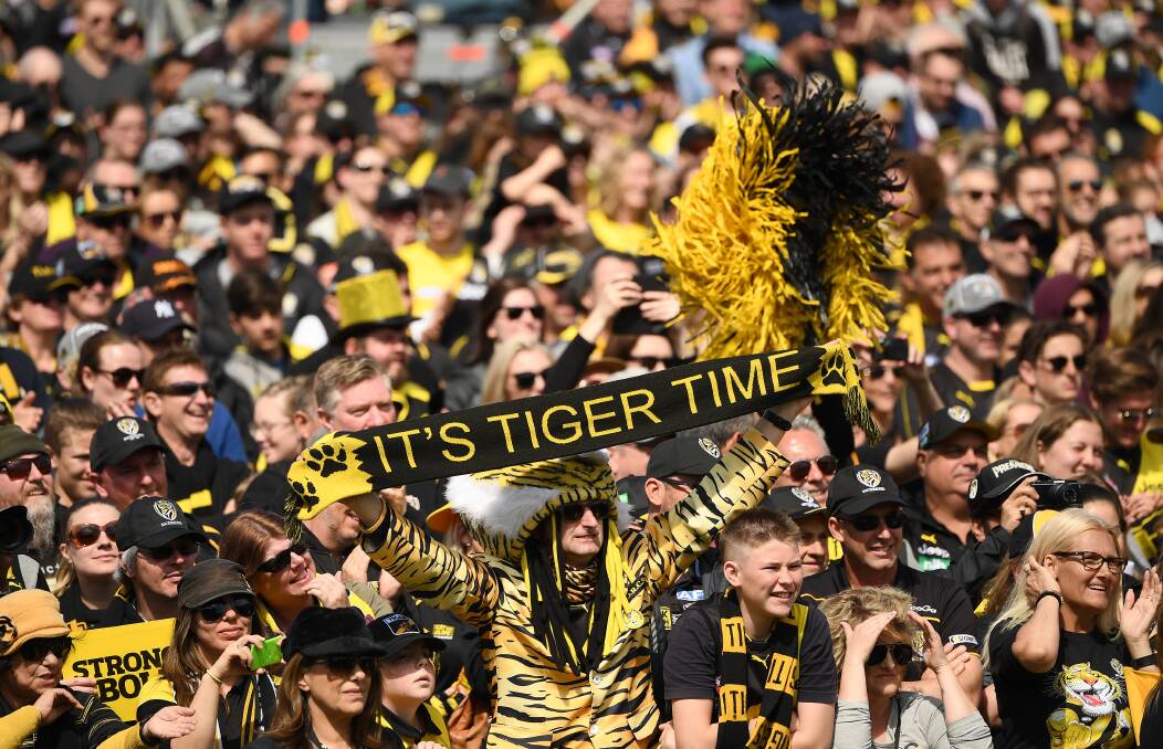 Fans celebrate Richmond Tigers' AFL Grand Final win last September. Will this year's premiership be tainted by the changes forced on teams because of the COVID-19 pandemic? Photo: Quinn Rooney/Getty Images