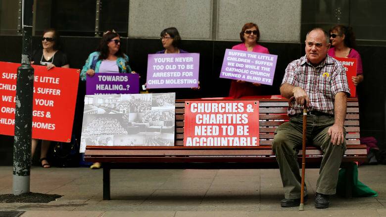 Les Johnson, who grew up in orphanages in the Newcastle and Gosford areas, sits outside the royal commission hearings in 2013. Photo: Kate Geraghty