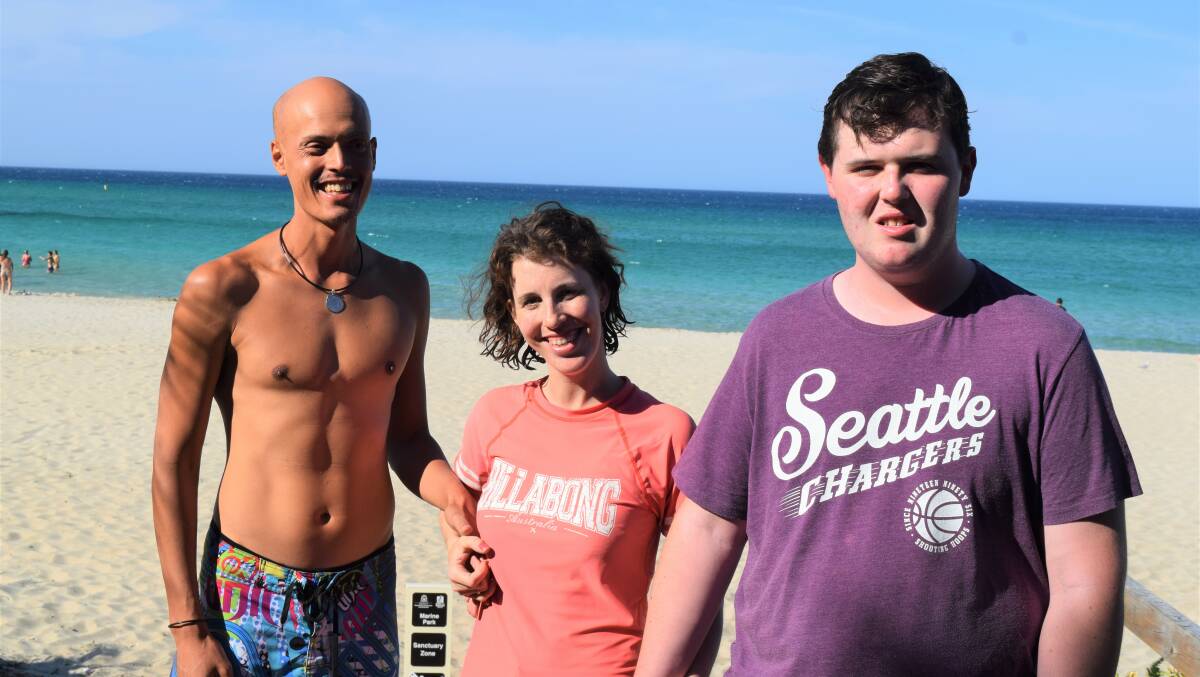 Josh Yates, with girlfriend Genevieve Day, and Jarvis Gibbons have been making the most of the region's beaches and the 'Let's go surfing' days this summer. .
