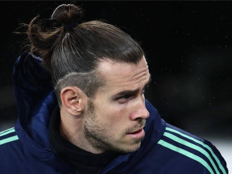 Wales winger Gareth Bale is "not ecstatic" to be at Real Madrid, according to his agent.